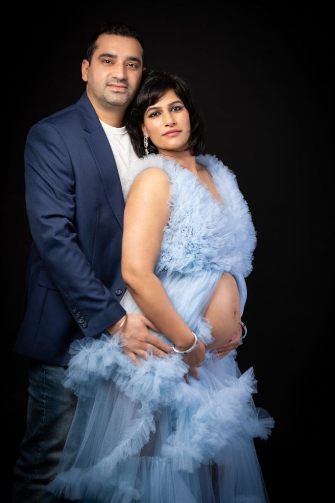Editorial-style maternity photography with clean backgrounds and flattering light