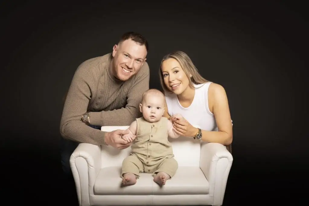 parents sitting with baby during Birmingham family photography studio session