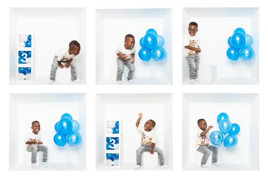 Inside the box photography collage of a young child celebrating a birthday with blue balloons inside a white studio box.