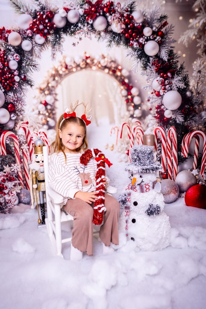 Child in festive attire with decorations
